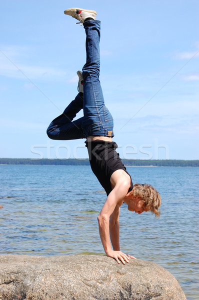 Man standing on its hands on egde Stock photo © vetdoctor