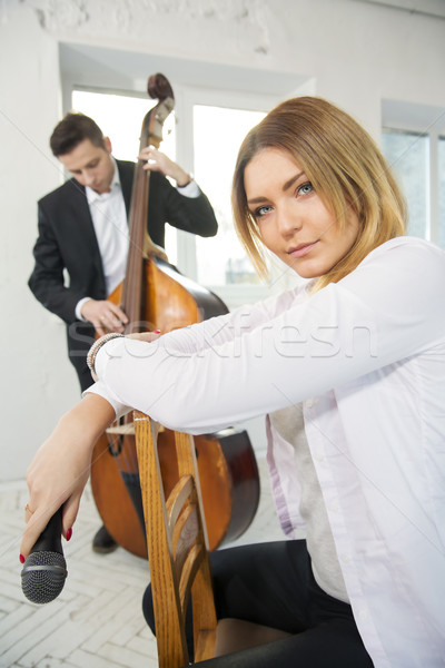 Woman backwards on chair holding microphone Stock photo © vetdoctor