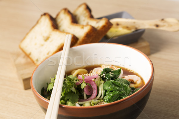 Bowl with brownish broth, shrimp and parsley Stock photo © vetdoctor