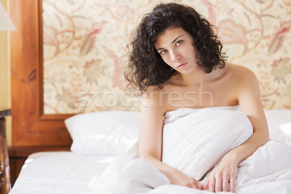 Woman under soft cover thinkink about day Stock photo © vetdoctor