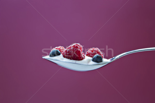 Few blueberries and raspberries in cream Stock photo © vetdoctor