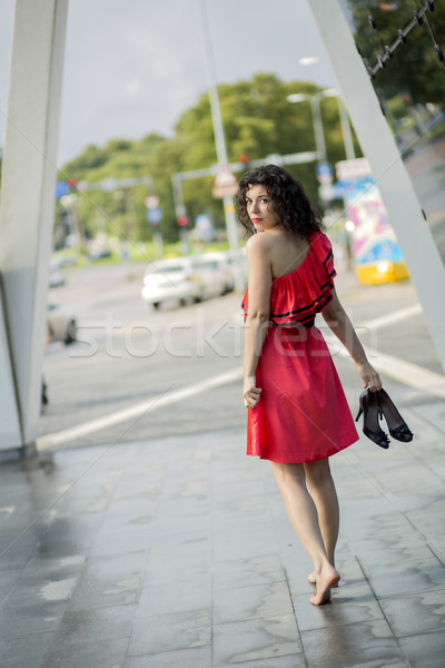 Woman in red dress looking back Stock photo © vetdoctor