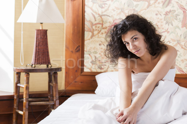 Woman stretches herself in bed after night Stock photo © vetdoctor