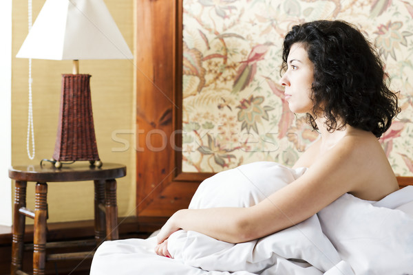 Woman under soft cover look to side Stock photo © vetdoctor