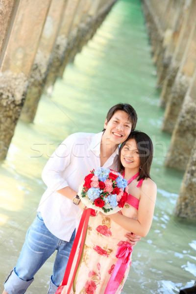 Ritratto sorridere coppie pier spiaggia fiori Foto d'archivio © vichie81
