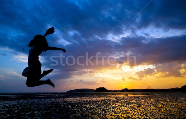 jumper at beach sunset Stock photo © vichie81