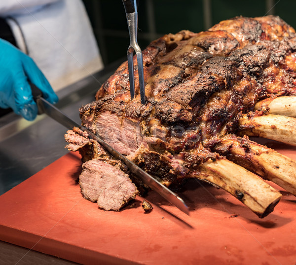 Stock photo: Chef carving beef