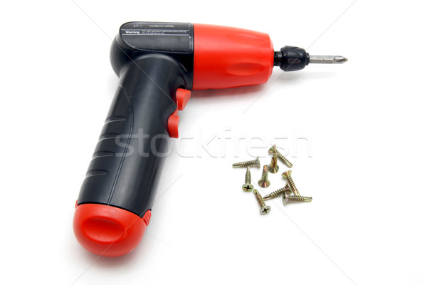 Stock photo: battery wireless screwdriver and set of screw on white