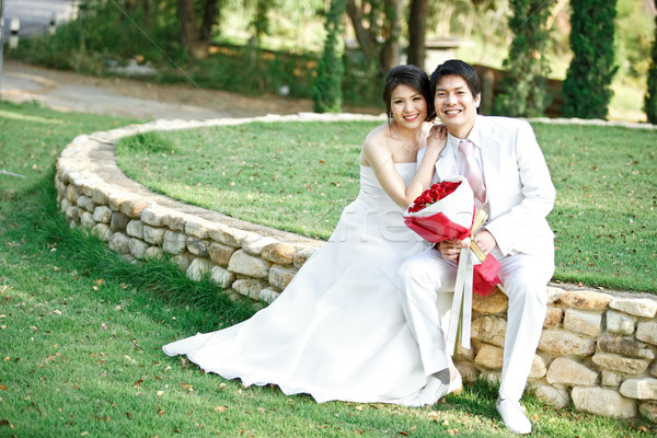 couples of bride and groom on green meadows Stock photo © vichie81