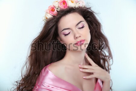 Beautiful sensual woman wearing a fur coat over pink Stock photo © Victoria_Andreas
