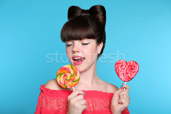 Lollypop. Beauty fashion teen girl with colourful eating colourf Stock photo © Victoria_Andreas