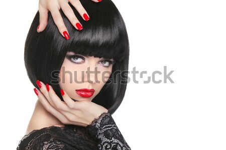 Beauty Brunette Woman with glamour bright makeup and red manicur Stock photo © Victoria_Andreas