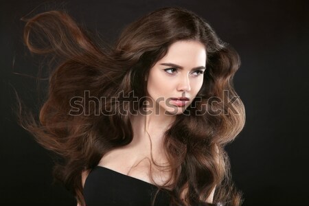 Hairstyle. Brown Hair. Attractive smiling girl with long Curly H Stock photo © Victoria_Andreas