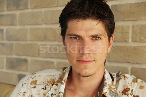 Handsome man casually leaning against the wall Stock photo © Victoria_Andreas