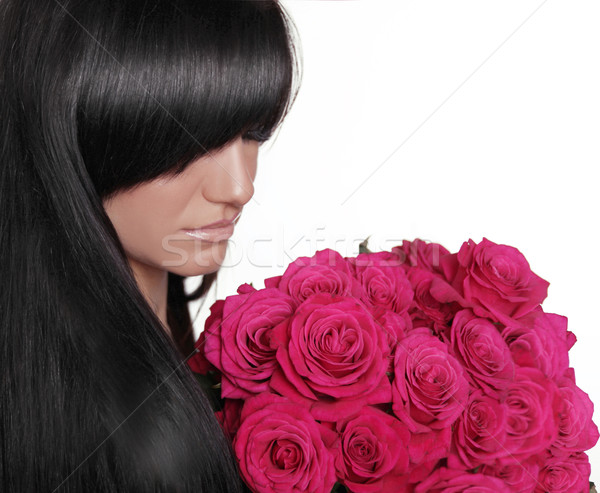 Brunette woman with fringe holding pink bouquet of roses isolate Stock photo © Victoria_Andreas
