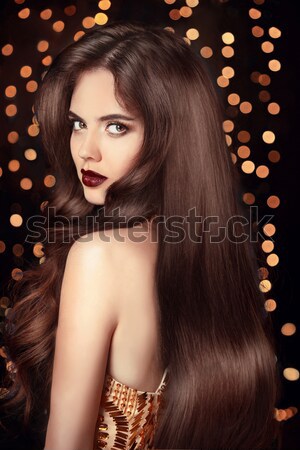 Fashion brunette girl with Long curly hair, beauty makeup, luxur Stock photo © Victoria_Andreas