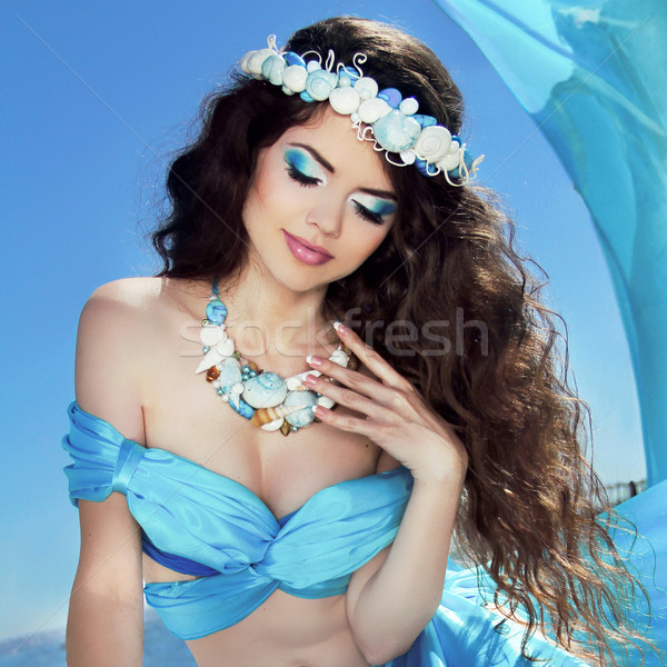 Makeup. Sea jewelry. Long Healthy Hair. Beautiful girl in blue s Stock photo © Victoria_Andreas