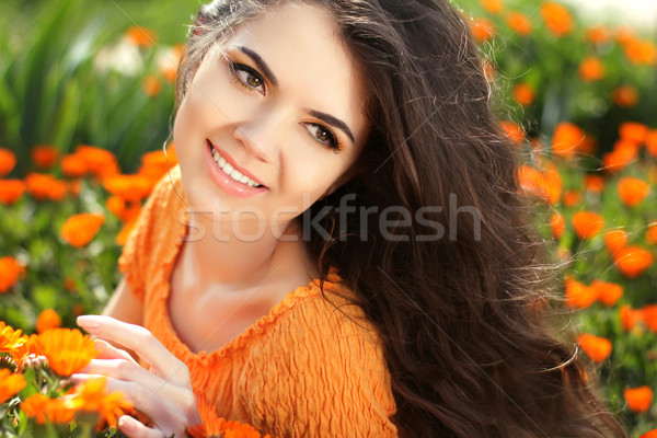 Beauty woman portrait with flowers. Free Happy Brunette Enjoying Stock photo © Victoria_Andreas