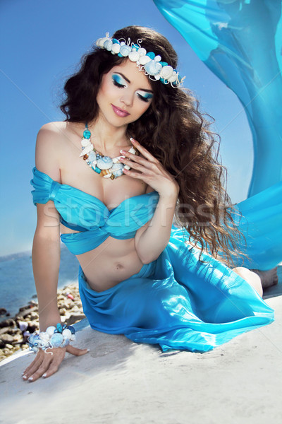 Long Healthy Hair. Beautiful brunette woman in blue silk luxury  Stock photo © Victoria_Andreas