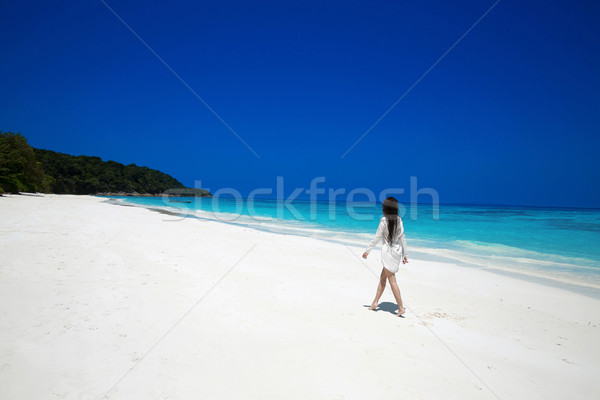 Carefree happy woman walking on tropical beach, exotic island. S Stock photo © Victoria_Andreas