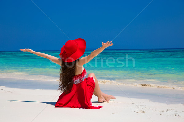 Beautiful woman in hat enjoying and relaxing on beach with white Stock photo © Victoria_Andreas