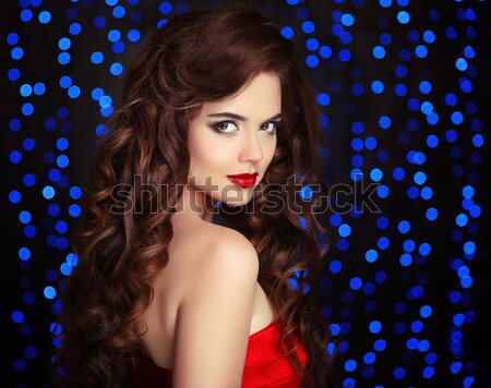 Makeup. Elegant hairstyle. Beautiful brunette with long wavy hai Stock photo © Victoria_Andreas