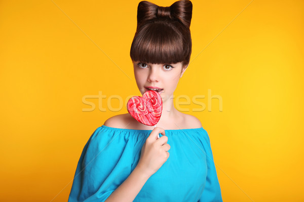 Lollypop. Beauty fashion teen girl with colourful eating colourf Stock photo © Victoria_Andreas