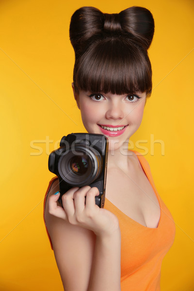 Beautiful smiling teen girl taking a photo. Pretty model is a pr Stock photo © Victoria_Andreas