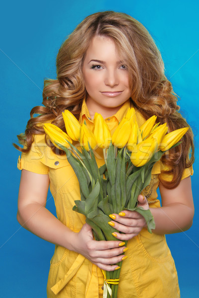 Beautiful Girl With Tulip Flowers over blue. Beauty Model Woman  Stock photo © Victoria_Andreas
