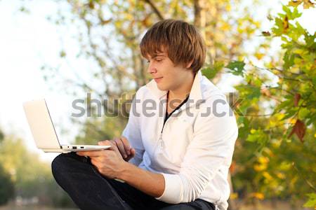 portrait of young man read the book, outdoor autumn Stock photo © Victoria_Andreas