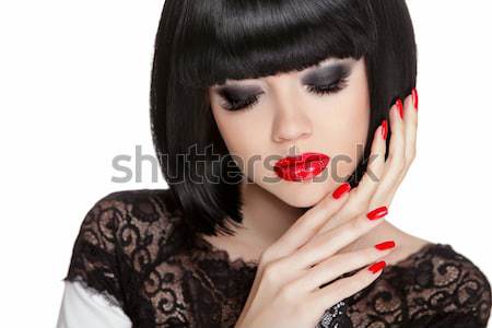 Fashion portrait of brunette woman in sunglasses showing red man Stock photo © Victoria_Andreas