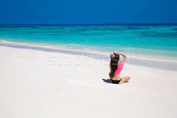 Happy brunette woman enjoying on exotic beach in summer by tropi Stock photo © Victoria_Andreas
