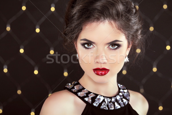 Stare. Elegant brunette woman lady with makeup and hairstyle. Fa Stock photo © Victoria_Andreas