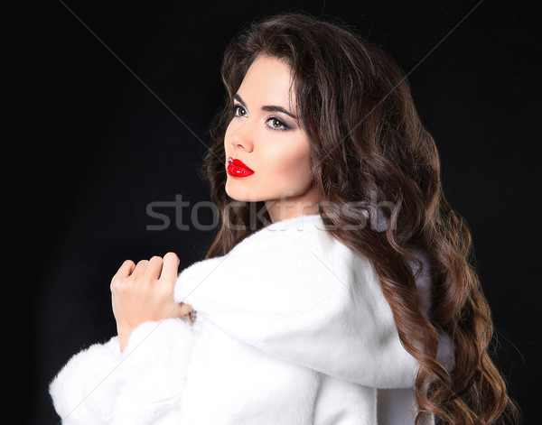 Fashion portrait of beautiful brunette girl in white fur coat. A Stock photo © Victoria_Andreas