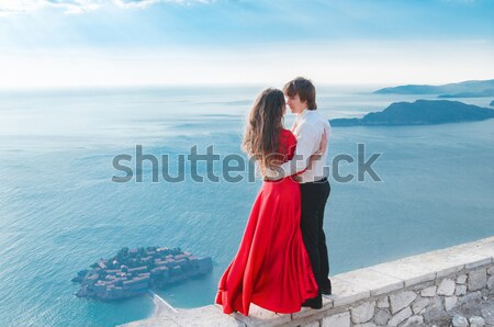 Stock photo: Romantic young couple in love over sea shore background. Fashion
