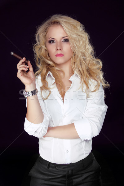 Stock photo: Woman with Cigar Exhaling Smoke on a Dark Background, Men style