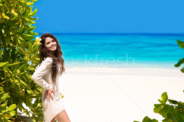 Free Happy smiling woman Enjoying Nature on tropical beach. Beau Stock photo © Victoria_Andreas