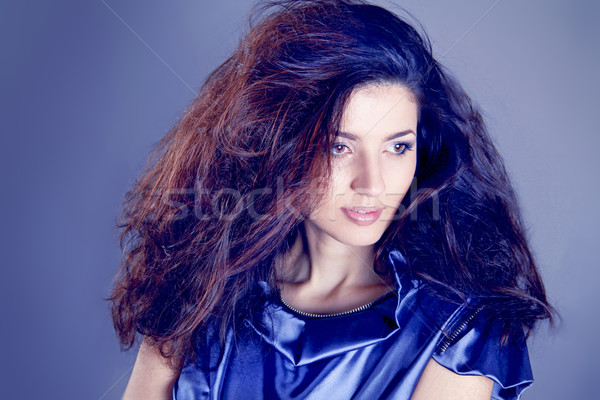 Fashion Brunette model over blue . Beautiful Makeup and Healthy  Stock photo © Victoria_Andreas