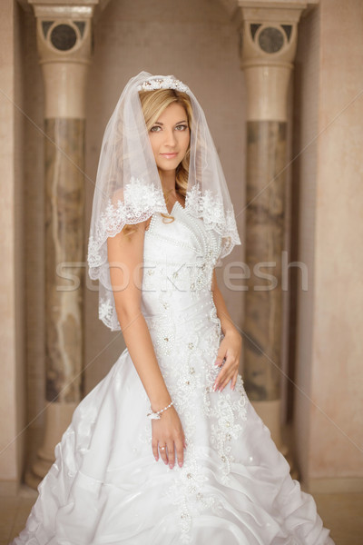 Beautiful smiling bride woman in wedding dress and bridal veil p Stock photo © Victoria_Andreas