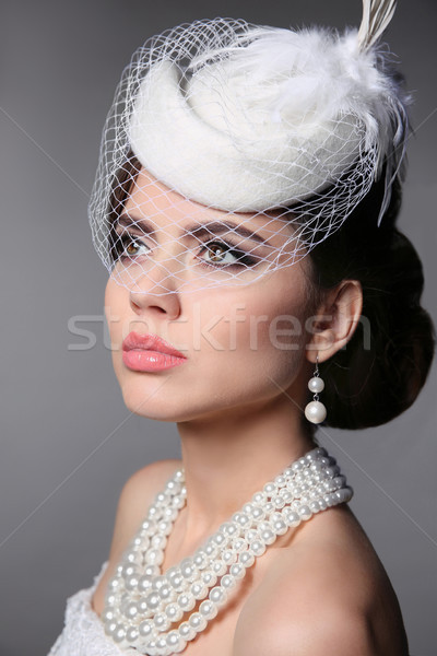 Fashion Brunette Retro Model Portrait. Pearls Jewelry and Hairst Stock photo © Victoria_Andreas