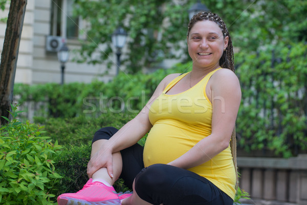 Mosolyog terhes nő kint boldog ül tavasz Stock fotó © vilevi