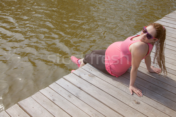 Pregnant Woman Quay Smiling Stock photo © vilevi