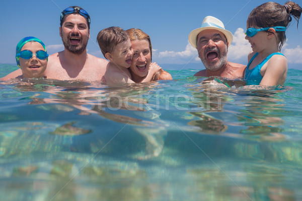 Generaciones mar agua familia feliz tres Foto stock © vilevi