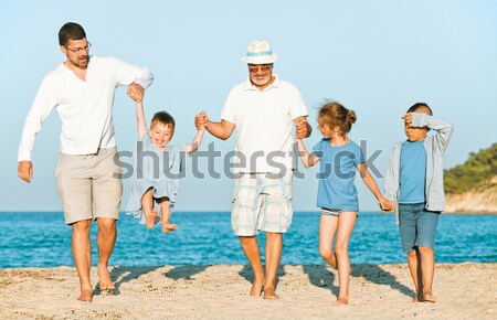 Running Generations Grandfather Kids Father Fun Beach Stock photo © vilevi