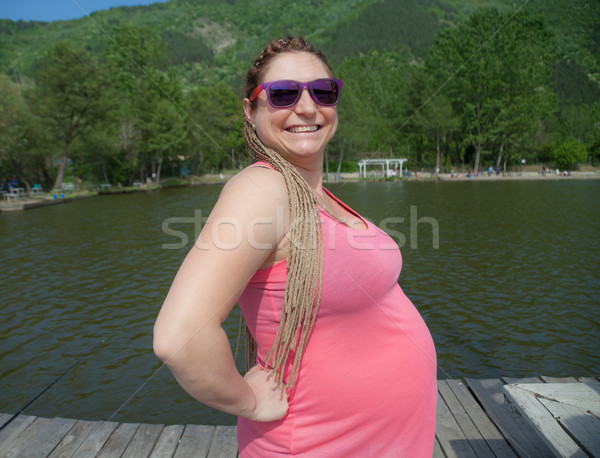 Happy Pregnant Woman Outdoors Stock photo © vilevi
