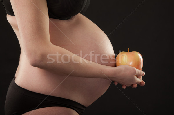 Torso Apfel Schwangerschaft schwanger weiblichen Hände Stock foto © vilevi