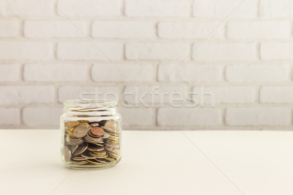 Save money with a coin jar Stock photo © vinnstock