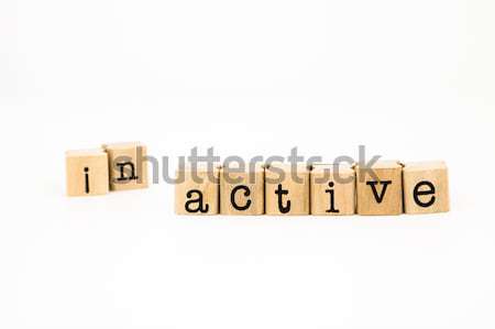 split inactive wording, active wording for motivation concept Stock photo © vinnstock