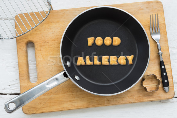 Letter biscuits word FOOD ALLERGY and cooking equipments. Stock photo © vinnstock