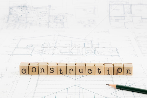 construction word blocks stack on blueprints and floor plan Stock photo © vinnstock